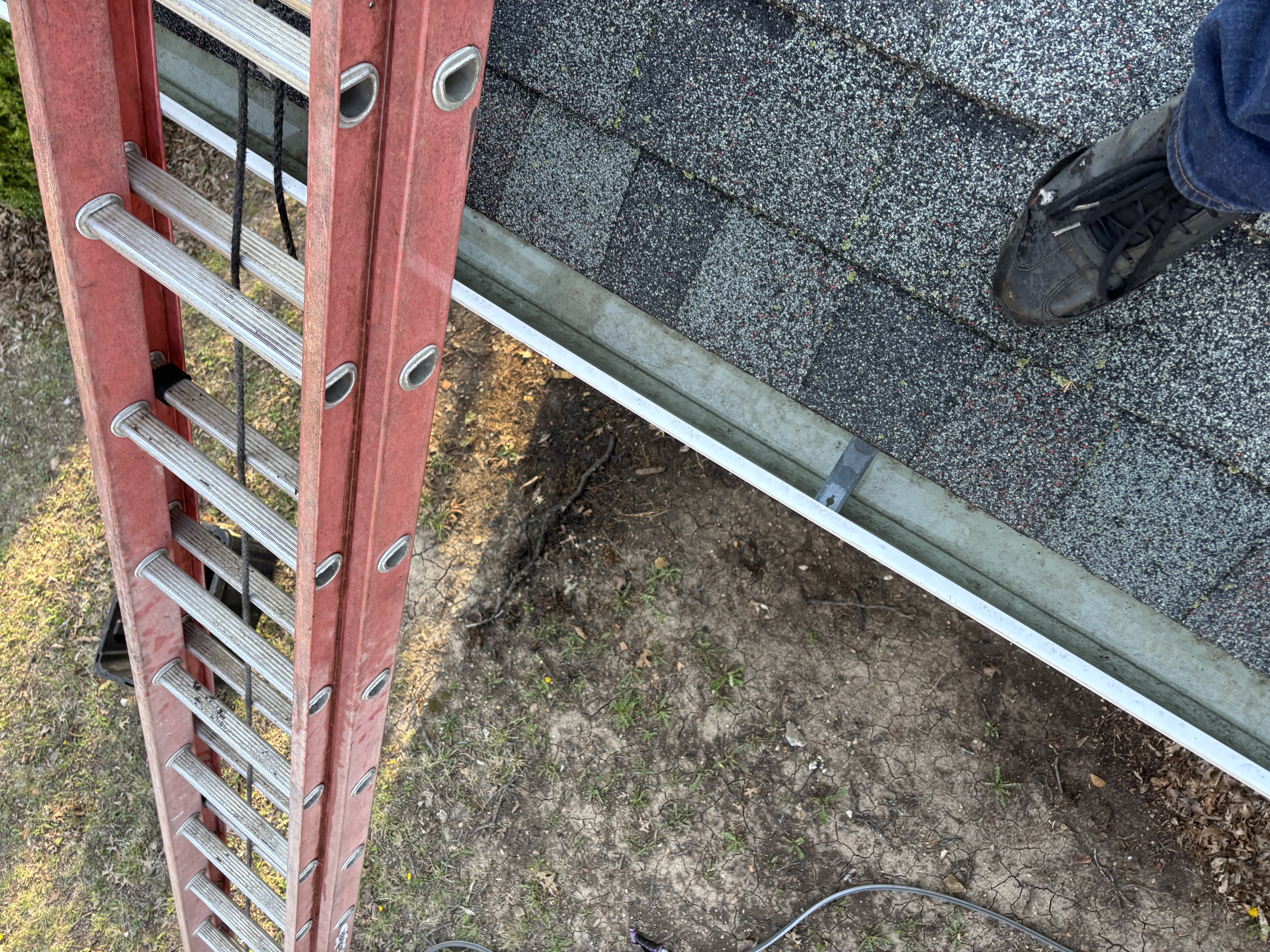 Ladder access at the roof edge for the front and back gutter run