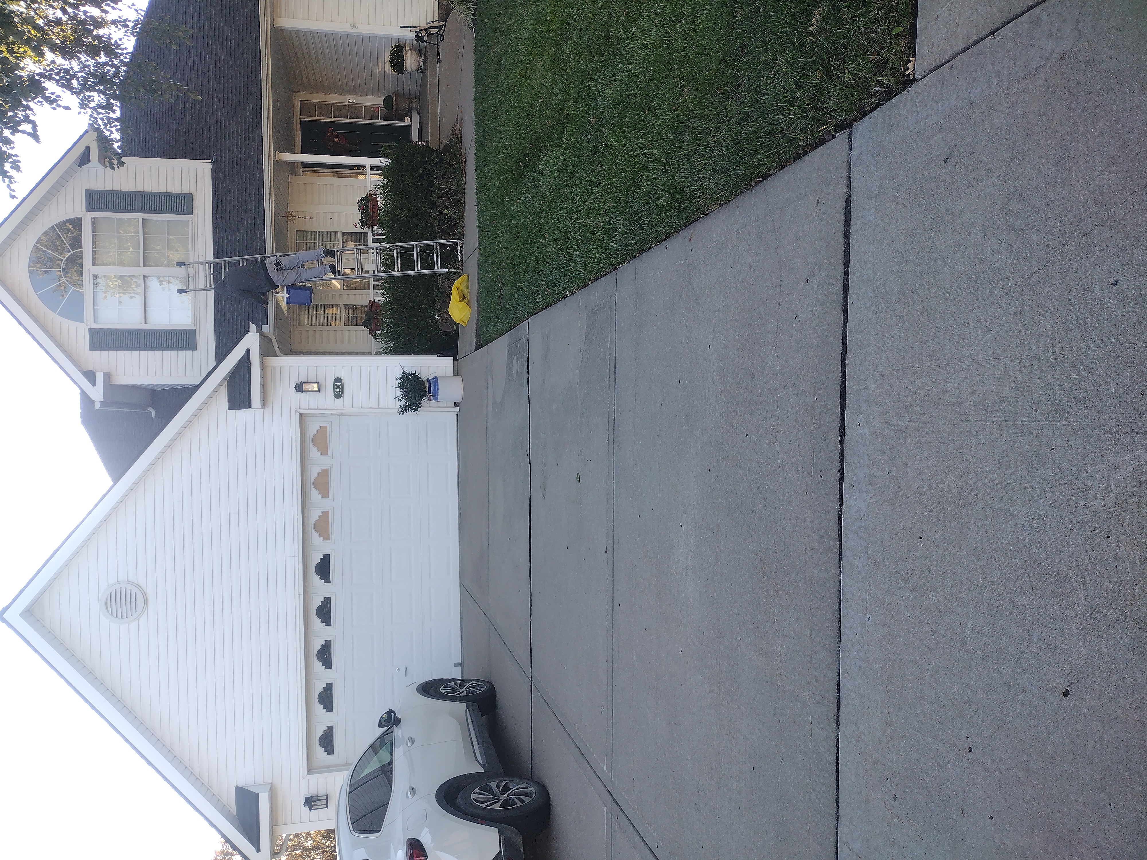 Front view of a Platte City walkout home with ladder access set for gutter cleaning