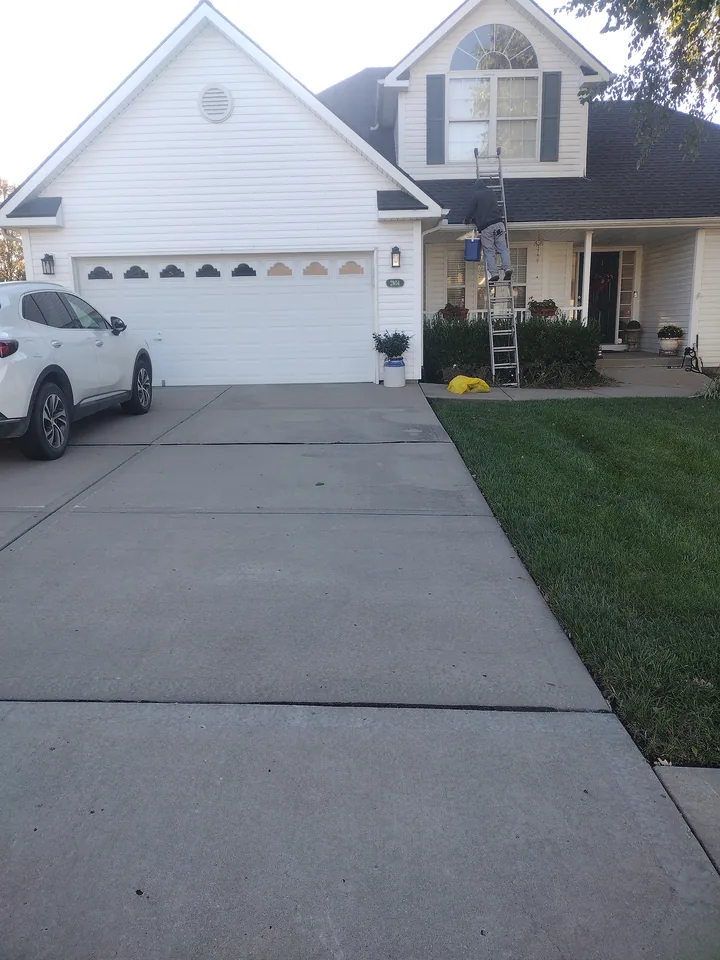 Front view of a Platte City walkout home with ladder access set for gutter cleaning