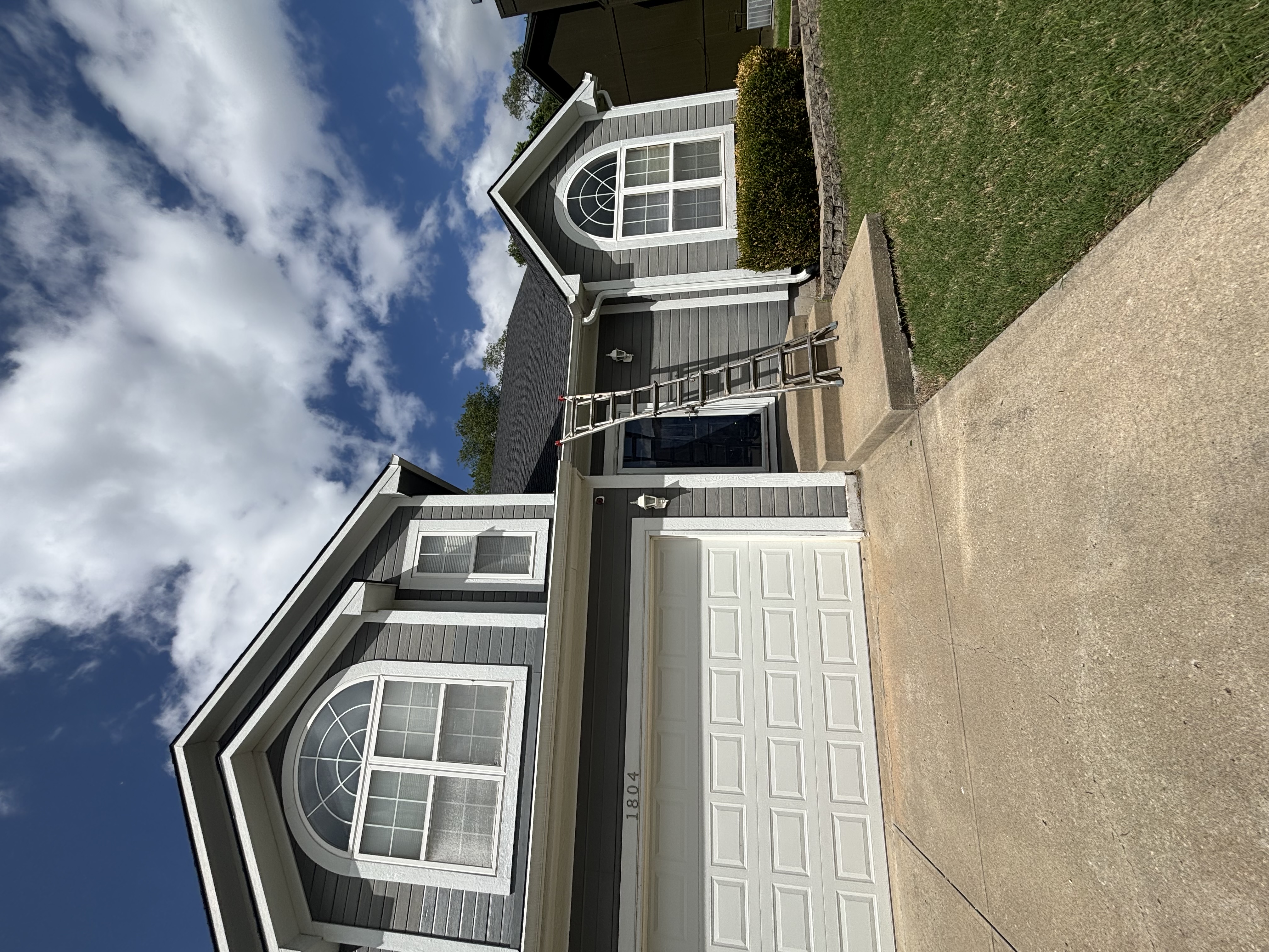 Two-story Kansas City home with detached two-car garage included in the gutter cleaning scope