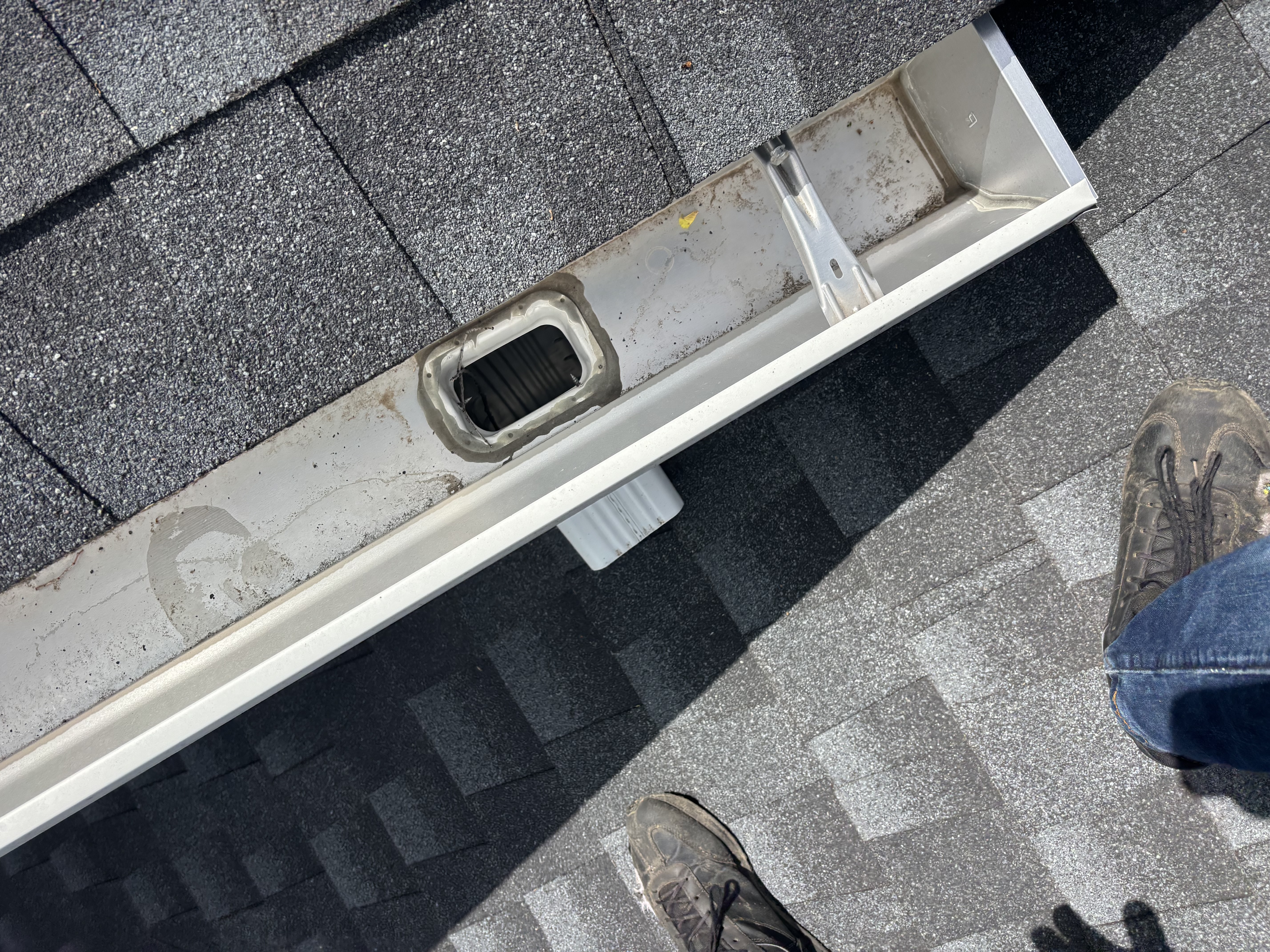 Downspout outlet opening after service
