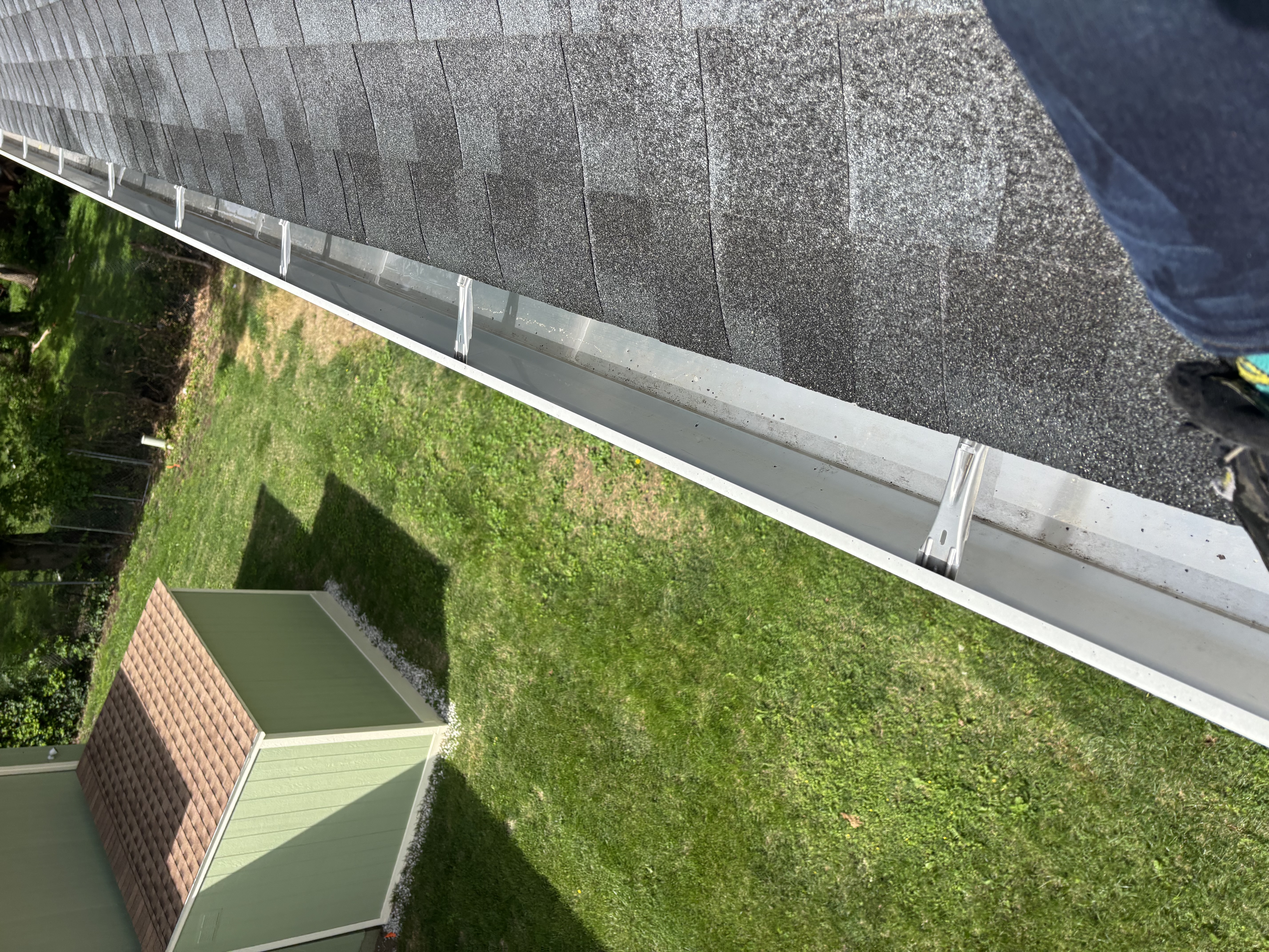 Same gutter run cleared after debris removal