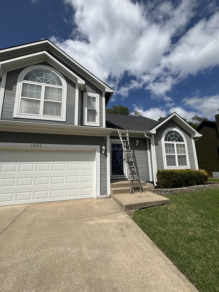Two-story Kansas City home with detached two-car garage included in the gutter cleaning scope