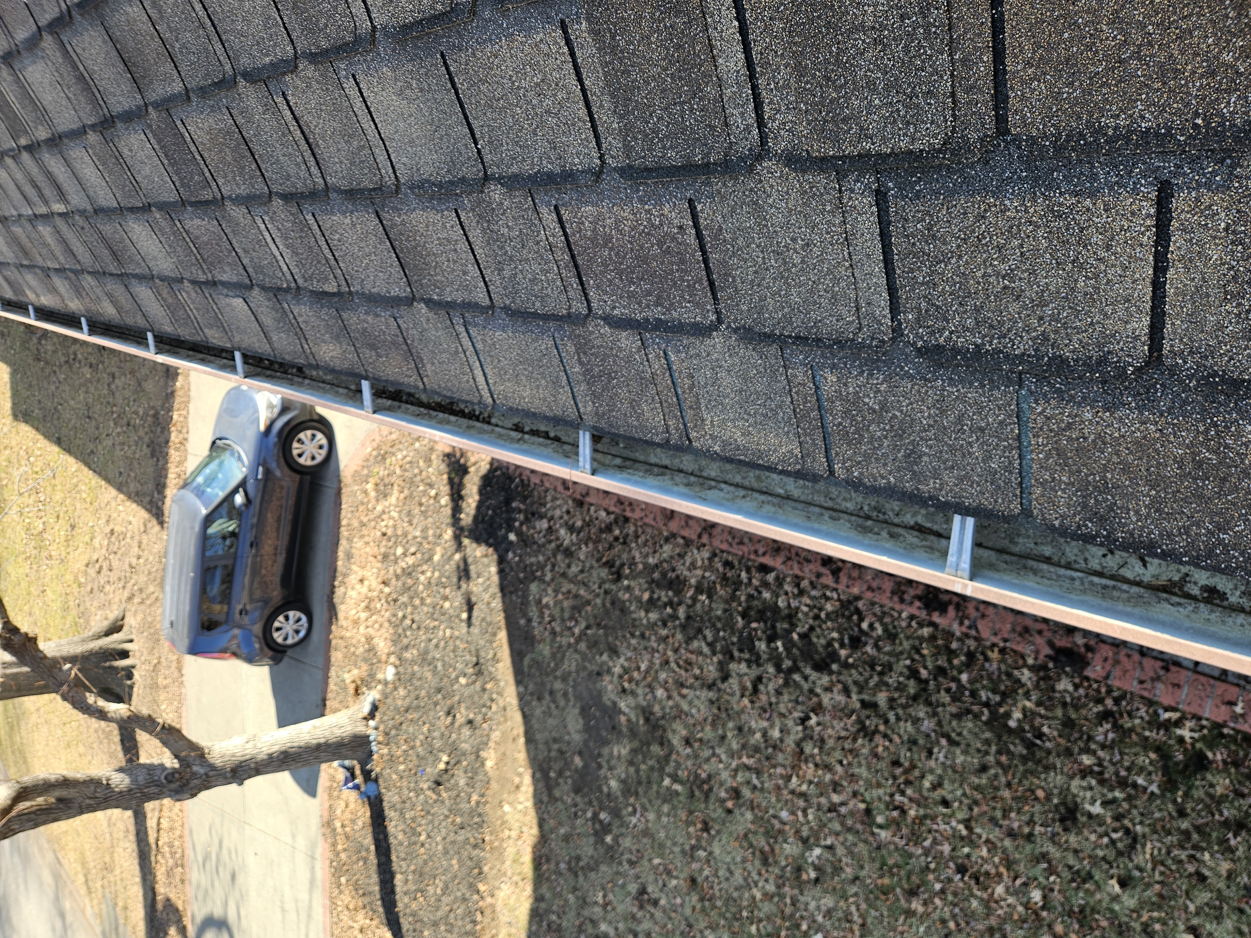 Long second-story gutter run after cleaning