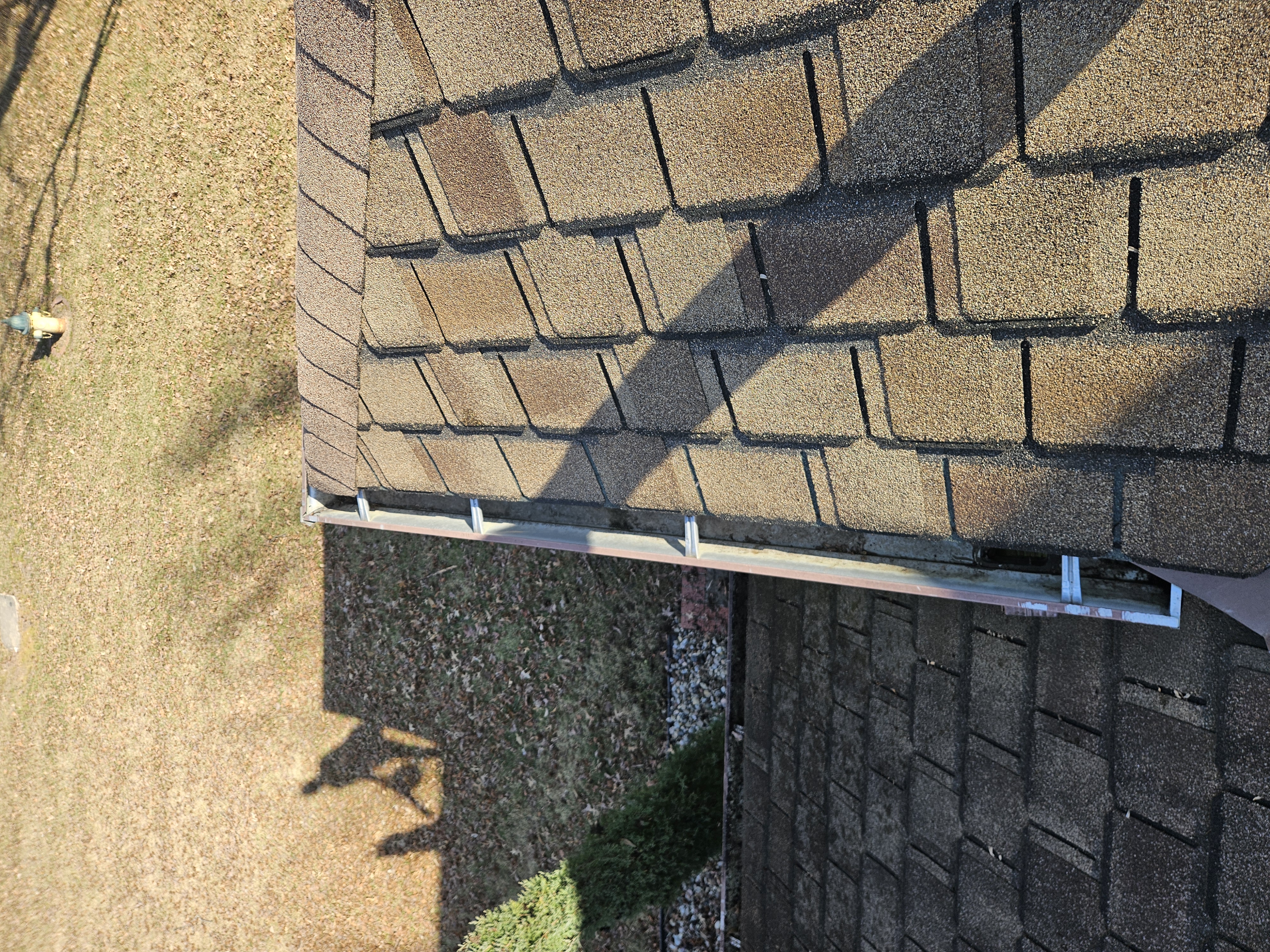 Long upper gutter run after cleaning on a two-story Kansas City home