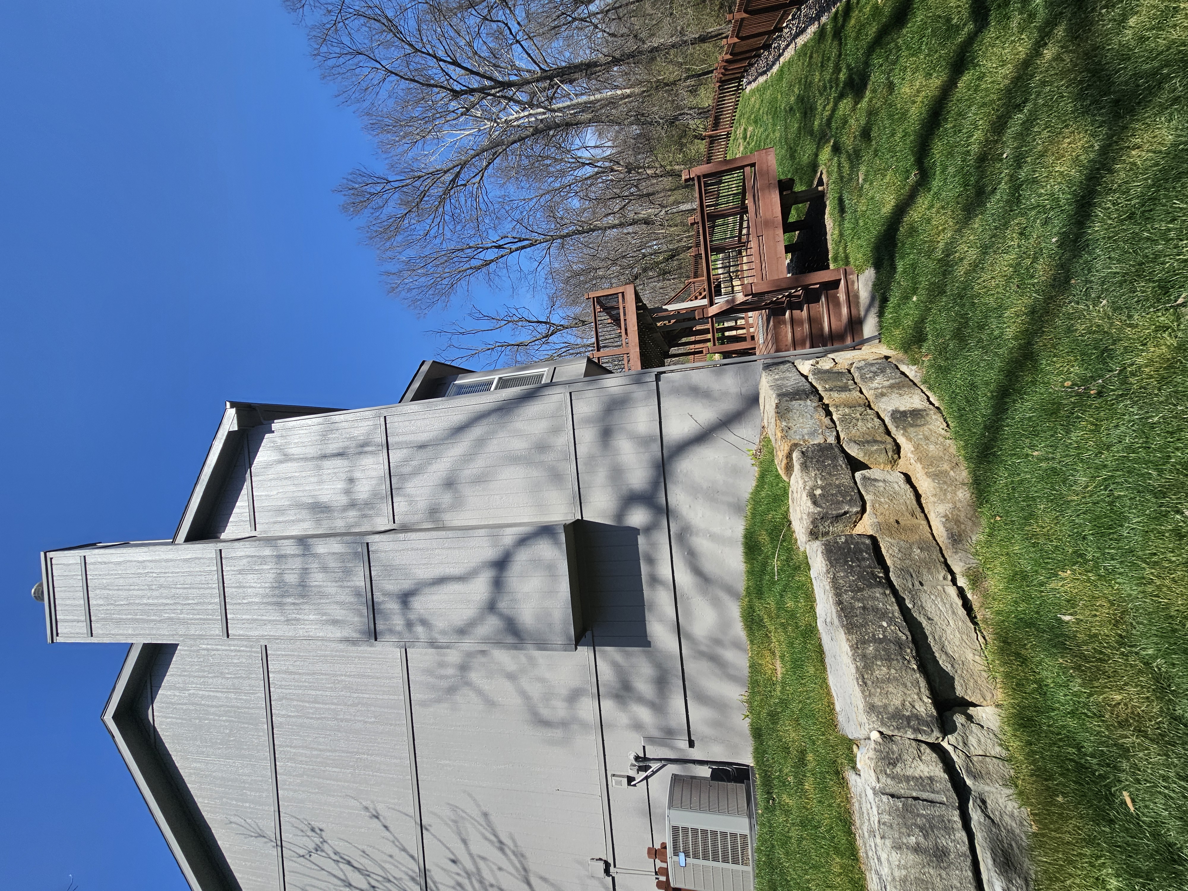 Rear walkout height context on a multi-level Liberty home