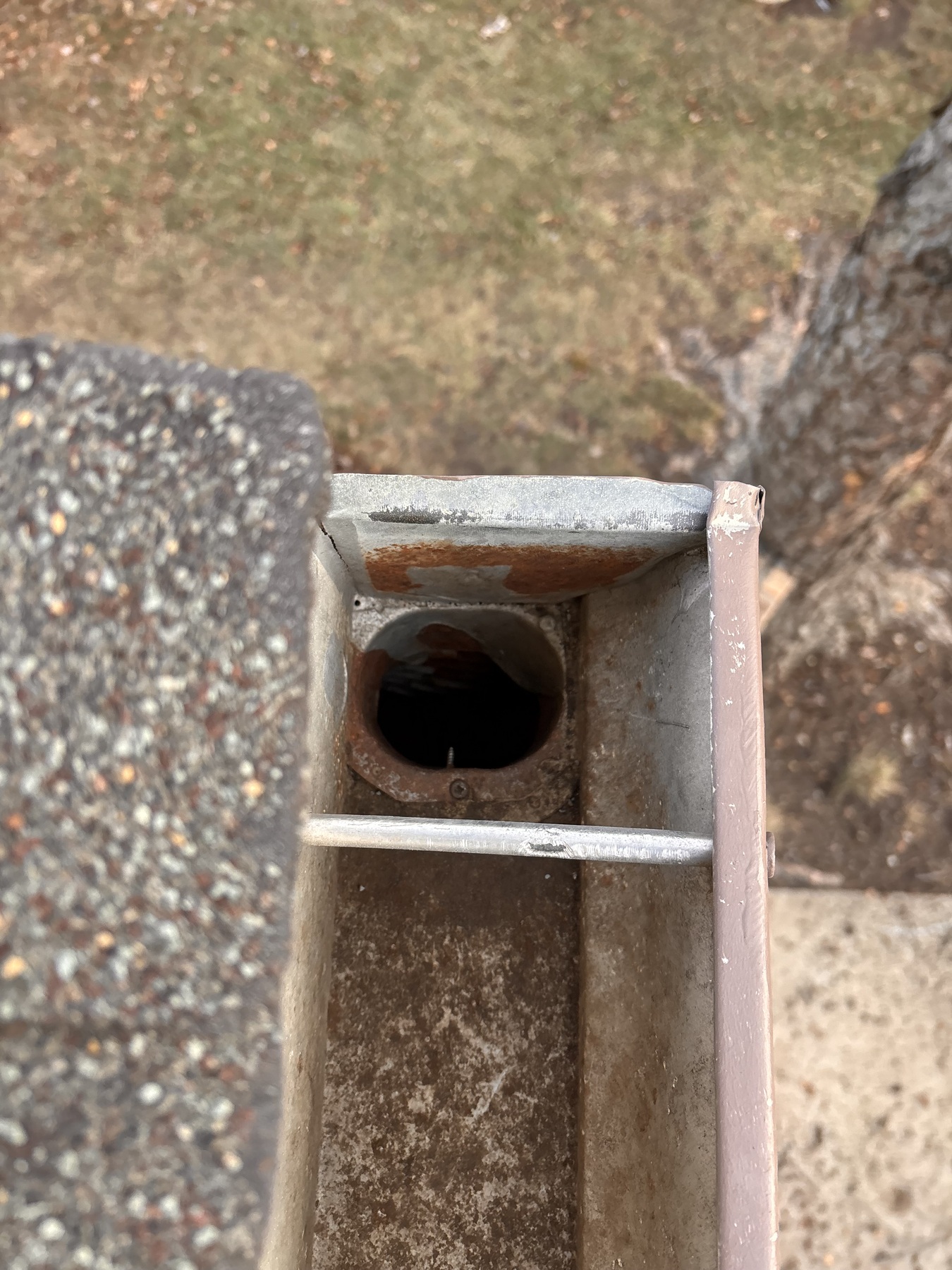 Downspout opening visible after cleaning