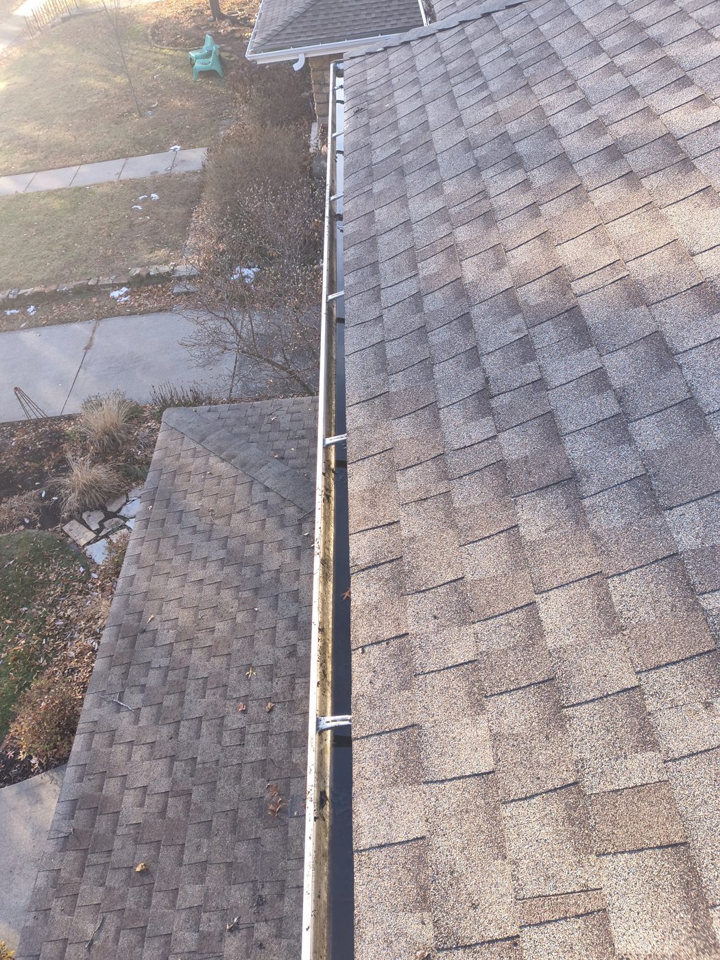 Same upper gutter run after debris was removed